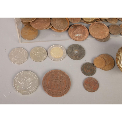 22 - A mixed collection of vintage world coins, including predominantly UK pennies, a 1991 Australia 50-c... 