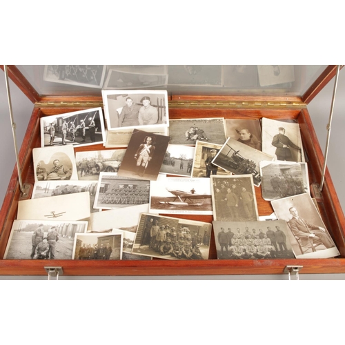 47 - A vintage military collection in a wooden display case, including a cased collection of I.S.T.D badg... 