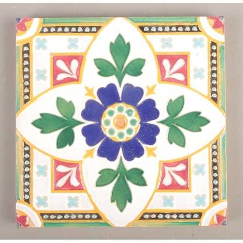 59 - Seven Minton & Co Majolica style tiles, with central floral motif. 15cm x 15cm.