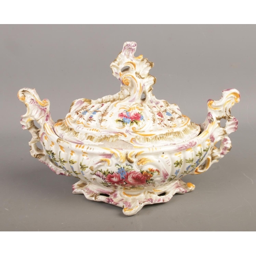 66 - A collection of porcelain items comprising an antique Rococo-style lidded bowl with glossy glaze and... 