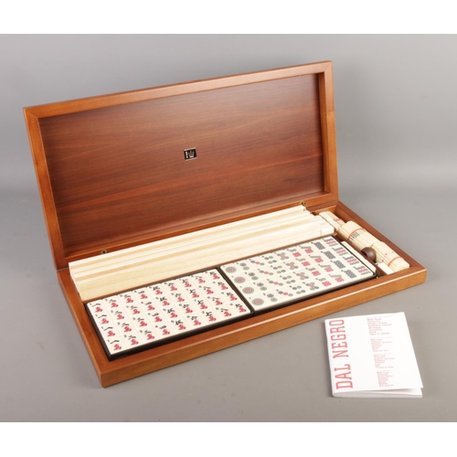 67 - A walnut cased Dal Negro Mahjong set, with booklet.