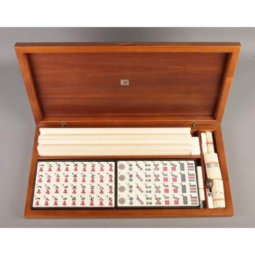 67 - A walnut cased Dal Negro Mahjong set, with booklet.