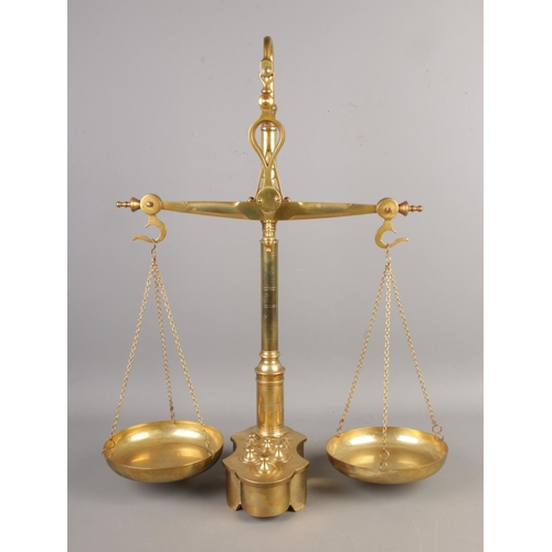 71 - A set of brass balance scales with inset weights