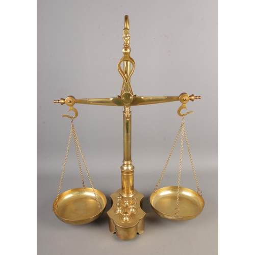 71 - A set of brass balance scales with inset weights