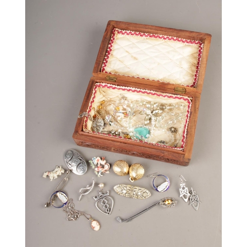 84 - A carved Indian box with a collection of Art Deco costume jewellery, pewter jewellery.