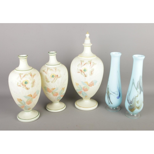 87 - A collection of art glass to include pair of vases and three floral urn shaped examples.