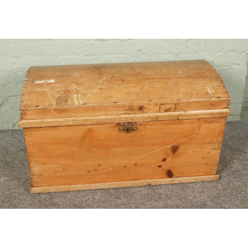 383 - An antique pine blanket chest, has dome top with new brass handles. Size W95 x D57 x H57cm.