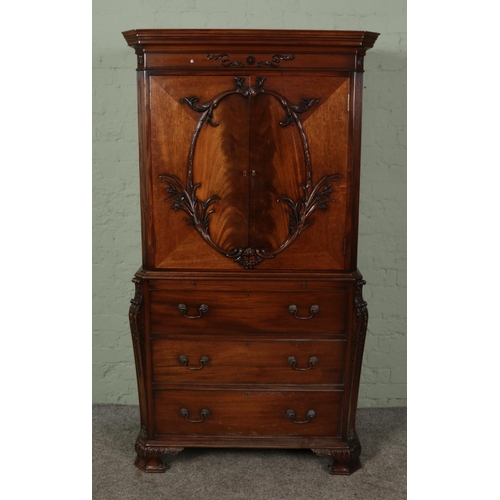 388 - A 20th century mahogany cabinet produced by Gostin of Liverpool.

Hx180cm
Wx98cm
Dx50cm