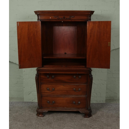 388 - A 20th century mahogany cabinet produced by Gostin of Liverpool.

Hx180cm
Wx98cm
Dx50cm