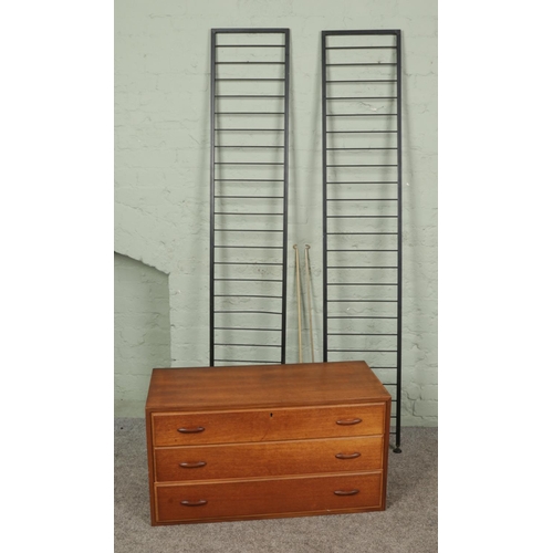 394 - A Ladderax room divider with one chest of drawers section