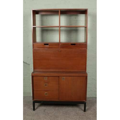 396 - A Wrightons teak three sectional unit with drawers, drinks cabinet and shelving 

Hx187cm
Wx99cm
Dx4... 