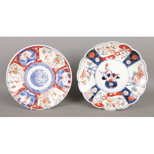 92 - Three antique Meiji Japanese porcelain plates and one square dish, hand-painted in a scalloped Imari... 