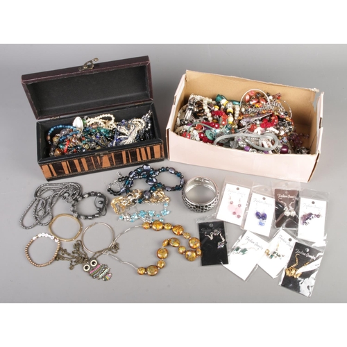 16 - Two boxes of assorted costume jewellery and accessories to include bracelets, necklaces, earrings, b... 