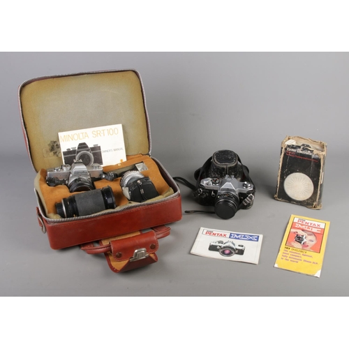 29 - Two vintage SLR cameras, one in fitted case, together with a quantity of accessories. Asahi Pentax M... 