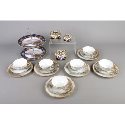 30 - A collection of oriental ceramics to include Noritake cake stand and trinket boxes along with a quan... 