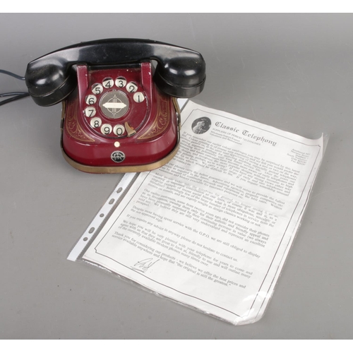 31 - A vintage Rotary Bell Telephone by the MFG Company in red along with original Classic Telephony info... 