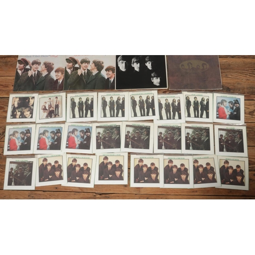 41 - A collection of The Beatles records and singles to include unboxed 1982 international release 'The B... 