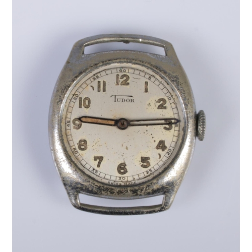 399 - A gents Tudor wristwatch head in white metal case featuring Arabic numeral markers.