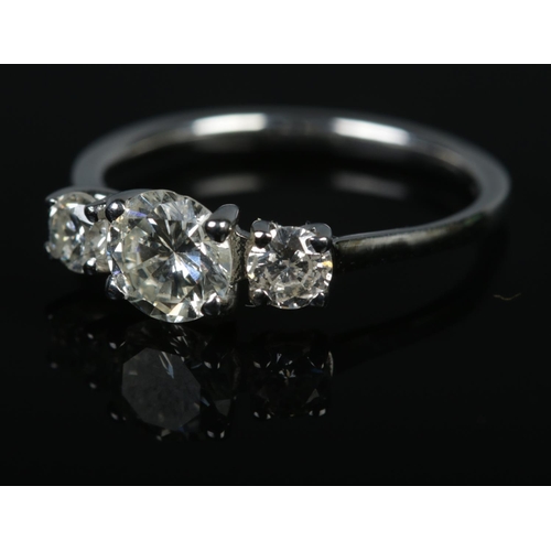 401 - A platinum three stone diamond ring, approx. diamond weight 1.16ct total with centre stone approx. 0... 