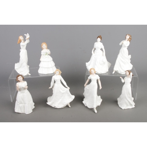 403 - Eight small Royal Doulton ceramic figures. Contains Welcome HN3764, Sentiments Good Luck HN4070, Har... 