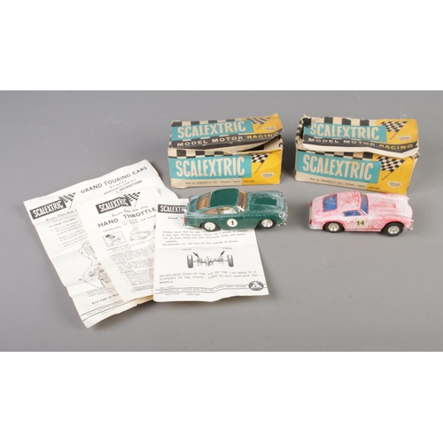 406 - Two boxed Scalextric racing cars to include Aston Martin DB4 GT MM/C68 No.1 in British racing green ... 