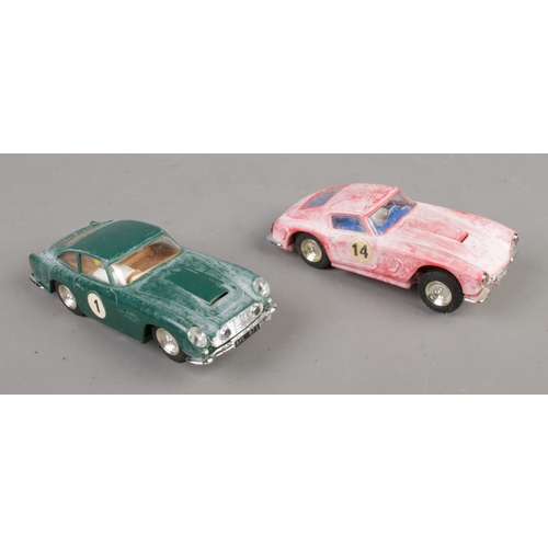 406 - Two boxed Scalextric racing cars to include Aston Martin DB4 GT MM/C68 No.1 in British racing green ... 