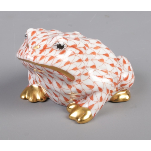 416 - A Herend of Hungary hand painted porcelain frog in a red fish scale pattern, model number 15321. App... 