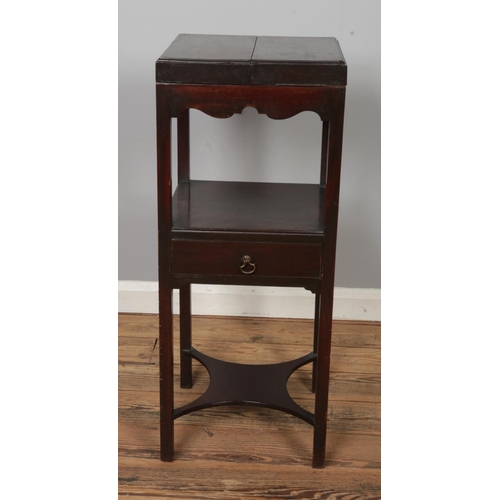 472 - A two tier mahogany washstand featuring hinged lid and single drawer. Approx. dimensions 36cm x 35cm... 