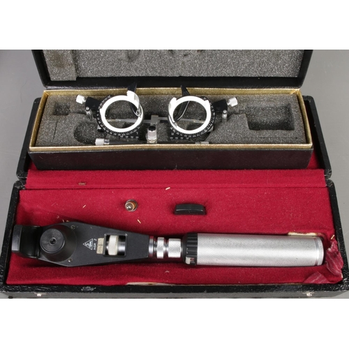 10 - Six boxed vintage optician tools: Perkins tonometer, Heine ophthalmoscope and otoscope, Keeler ophth... 