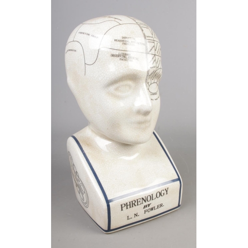 24 - A L.N. Fowler ceramic phrenology head. Height: 29cm.