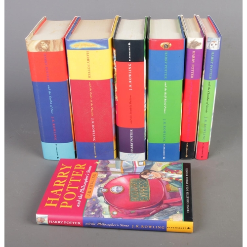 32 - J.K. Rowling's Harry Potter series, complete with seven hardcover books, all First Editions.