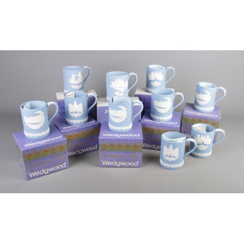 39 - Eight boxed Wedgwood Christmas mugs with two unboxed examples