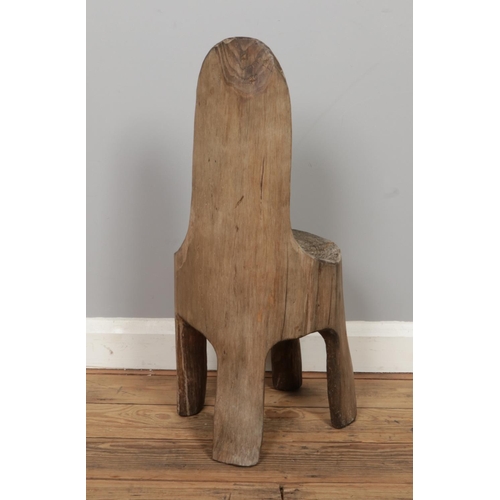 254 - A vintage tree trunk chair. Size: W29 x D32 x H65cm.