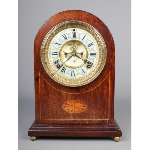 63 - An Ansonia mantel clock with mahogany body and enamel and gilt metal dial.

30x22cm