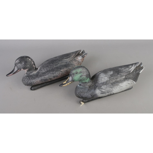 7 - Two vintage painted composite decoy ducks.