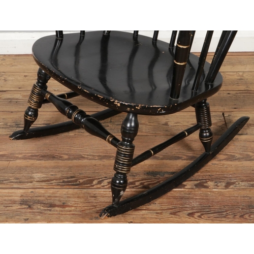 454 - A vintage black Boston rocker, with Windsor back and flower pattern on the headrest. Size W62 x D102... 