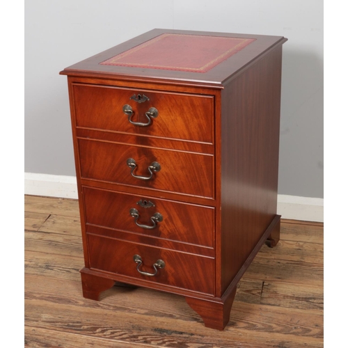 455 - A mahogany filling cabinet, with gold embossed red leather top and two drawers. Size W49 x D61 x H77... 