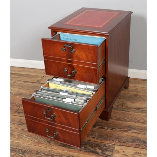 455 - A mahogany filling cabinet, with gold embossed red leather top and two drawers. Size W49 x D61 x H77... 