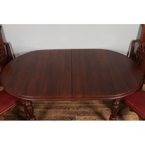 459 - A substantial mahogany ball and claw dining table with two additional leaves and set of ten chairs i... 