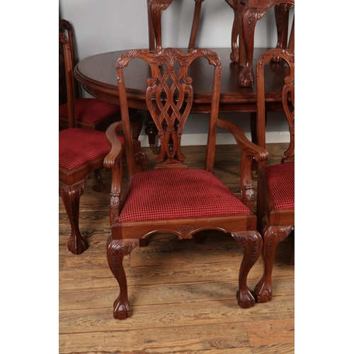 459 - A substantial mahogany ball and claw dining table with two additional leaves and set of ten chairs i... 