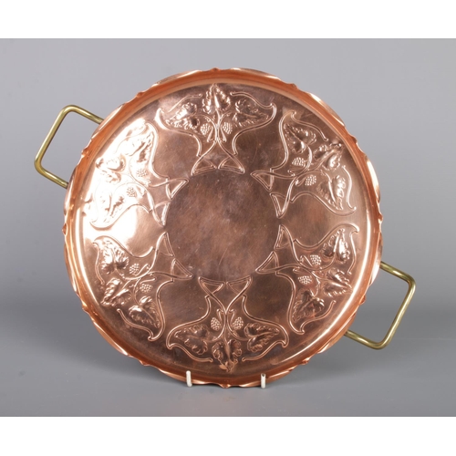 116 - A Joseph Sankey & Sons Art Nouveau designed copper tray, fluted edging and of circular form, marked ... 