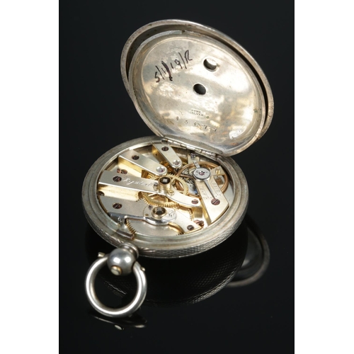 402 - A silver fob watch with engine turned case and monogram to back, stamped fine silver on the inside o... 