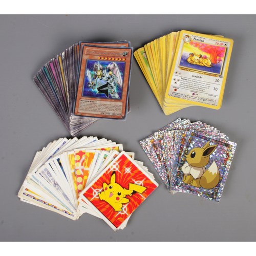 68 - A collection of Pokemon and YuGiOh trading cards, including Sinister Serpent, Valkyrion The Magna Wa... 