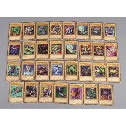 68 - A collection of Pokemon and YuGiOh trading cards, including Sinister Serpent, Valkyrion The Magna Wa... 