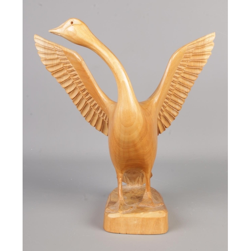 103 - A carved wooden figure of a goose by Mauno Veltheim, signed M Veltheim to the base, Mauno Veltheim w... 