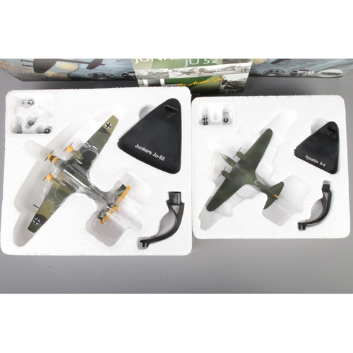 30 - Two boxed Atlas Editions WW2 diecast model planes on stands to include Junkers JU52 and Llyushin II-... 