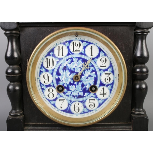 31 - An antique French Aesthetic movement mantel clock by Samuel Marti, featuring an ebonised case with t... 