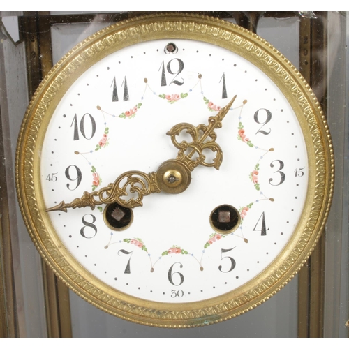 34 - An antique French marble pillared mantel clock by Bennet & Pottier, featuring an enamel dial with Ar... 