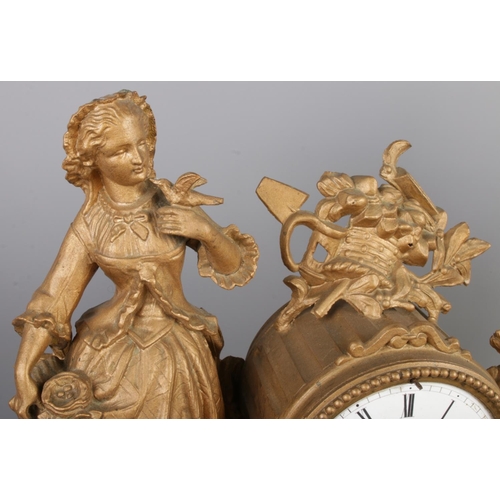 38 - An antique French gilt bronze figural mantel clock garniture, with two bronze candelabra. The clock ... 