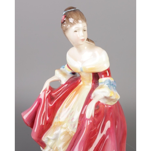 39 - A group of collectable porcelain figures, including five Royal Doulton figurines with Beswick animal... 